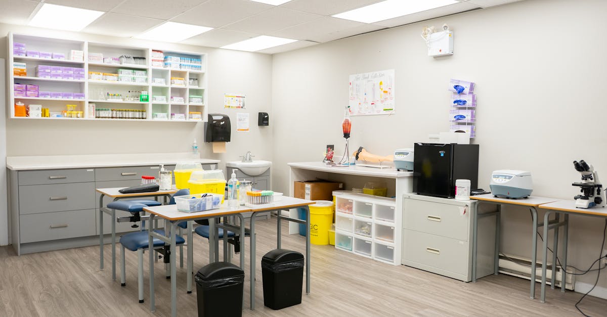 Bright and organized medical office interior featuring lab equipment and storage.