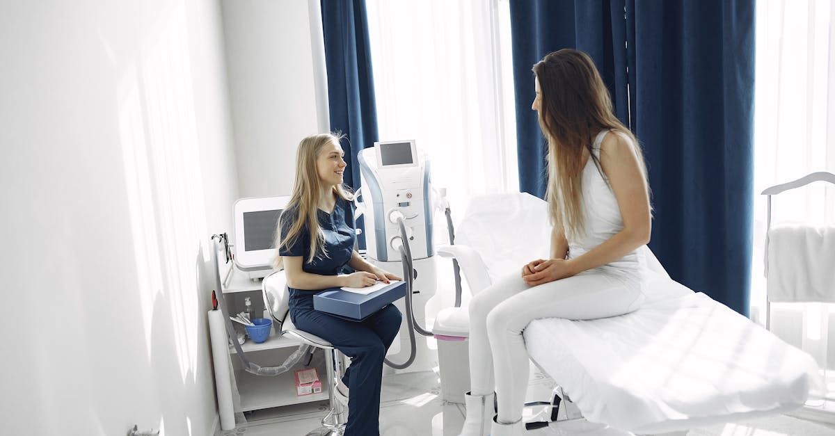A healthcare professional consulting with a patient in a bright, modern clinic setting.